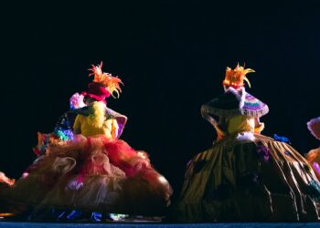 A group of people that are standing on a stage