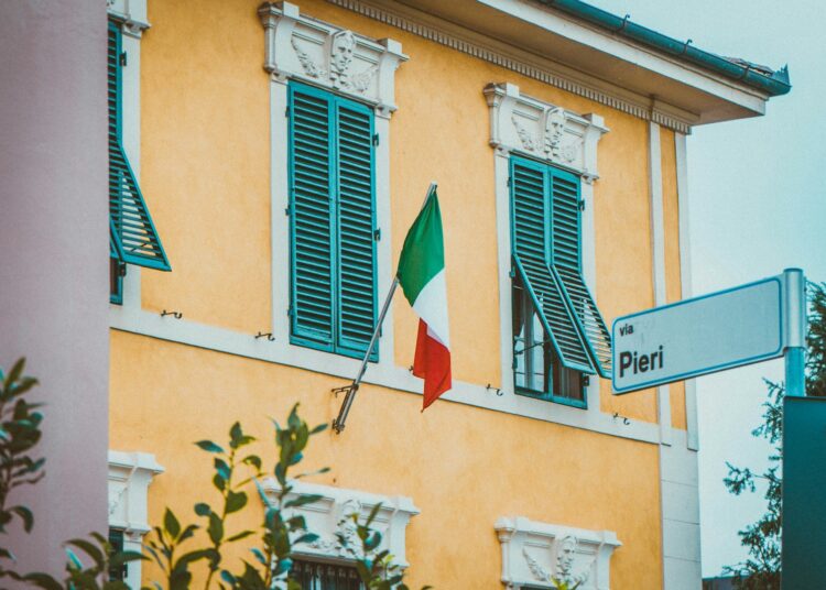 blue white and red flag on white concrete building