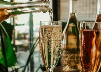 clear wine glass with brown liquid