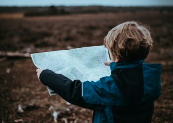 child looking at map