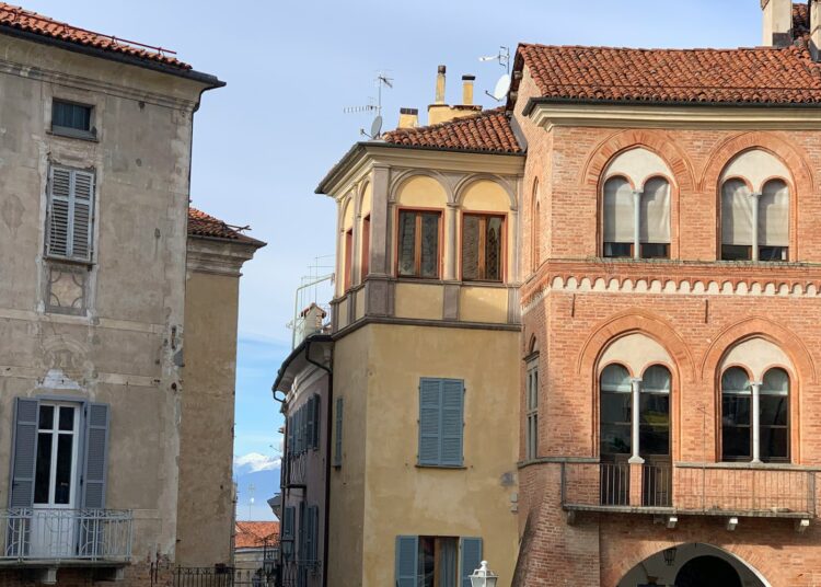 a tall building with a clock on the top of it
