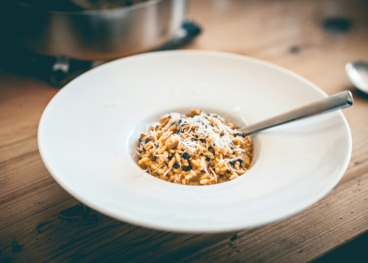 a bowl of food on a wooden table
