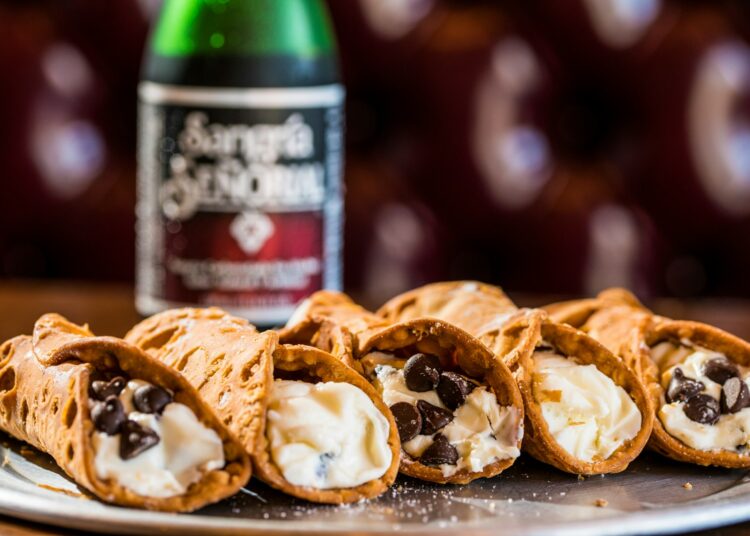 brown bread on white and red ceramic plate