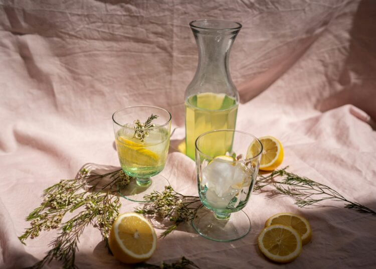 clear glass pitcher with lemon juice