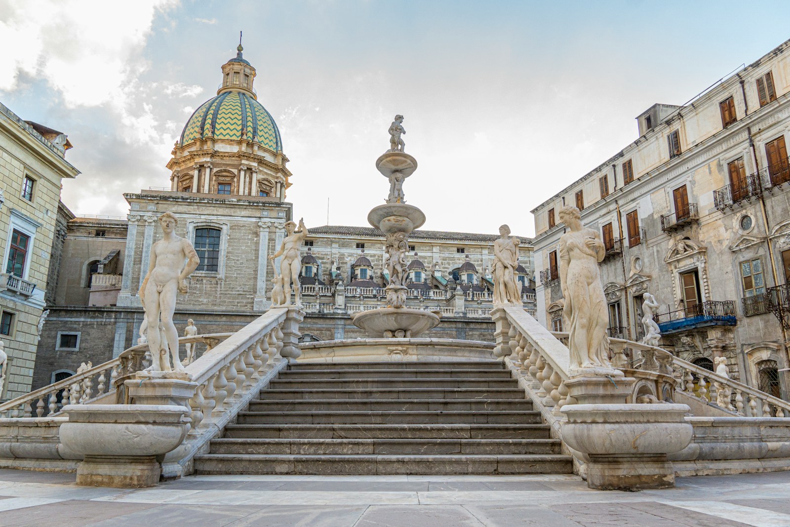A large building with a staircase leading up to it
